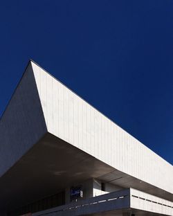 Low angle view of building against clear blue sky