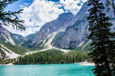Scenic view of lake and mountains against sky