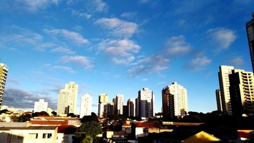 Modern buildings in city against sky