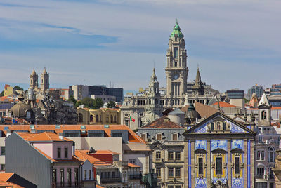 Buildings in city against sky