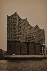 Buildings in city against clear sky