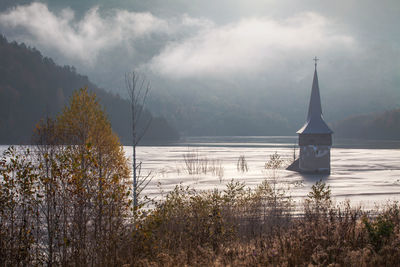 View of lake against cloudy sky