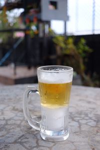 Close-up of beer glass on table
