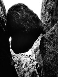 Low angle view of rock formation against sky