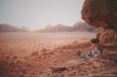 Scenic view of rocks on land against sky