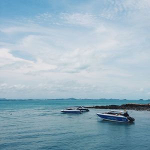 Boats moored in sea