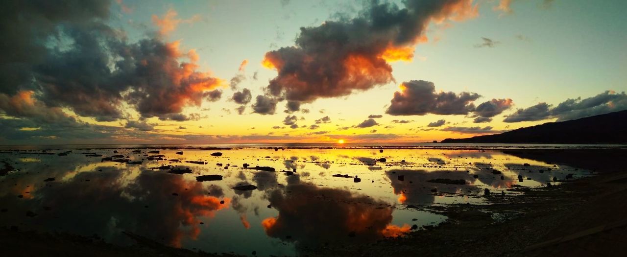 sky, water, cloud - sky, scenics - nature, beauty in nature, sunset, tranquil scene, tranquility, reflection, nature, no people, orange color, idyllic, sea, non-urban scene, outdoors, beach, remote