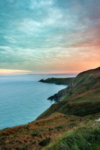 View of calm sea against cloudy sky