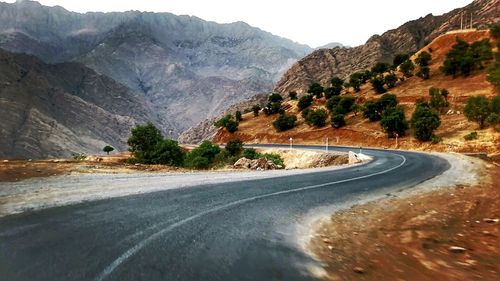 Country road with mountains in background