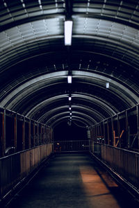 Illuminated empty subway tunnel