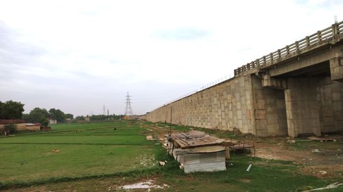 View of old building on field against sky