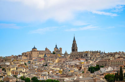 View of buildings in city against sky