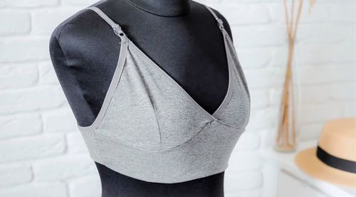 Rear view of black standing against white wall