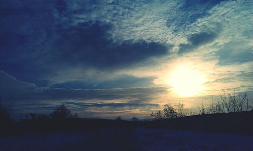 Scenic view of landscape against sky during sunset