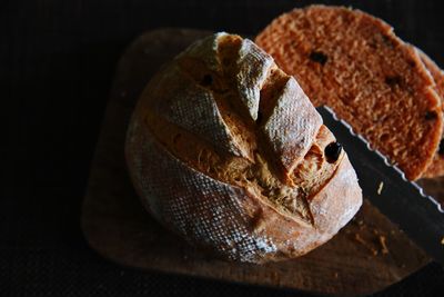 Close-up of knife and bread on table