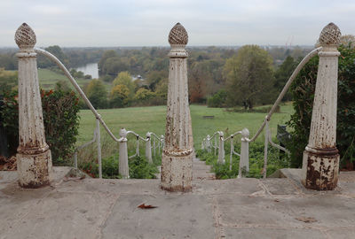 Cross on landscape against sky