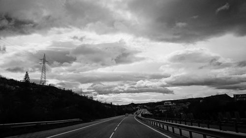 View of road against cloudy sky