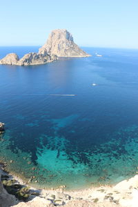 Scenic view of sea against clear blue sky