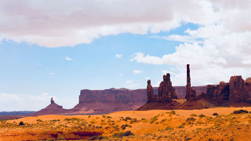 Rock formations on landscape against sky