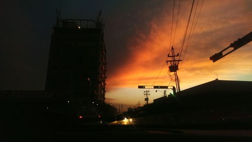 Buildings in city at sunset