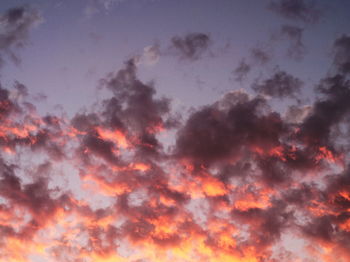 Low angle view of dramatic sky during sunset
