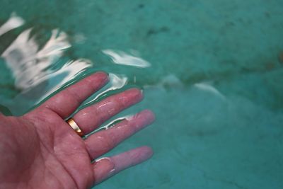 Close-up of hand with water