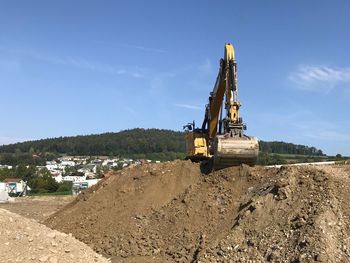 Construction site on field against sky