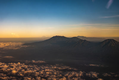 Scenic view of mountains against sky during sunset