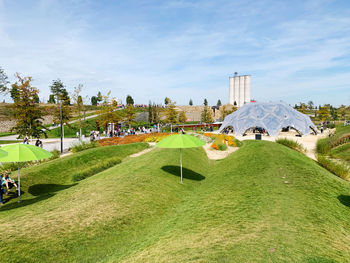 Panoramic view of park and buildings against sky