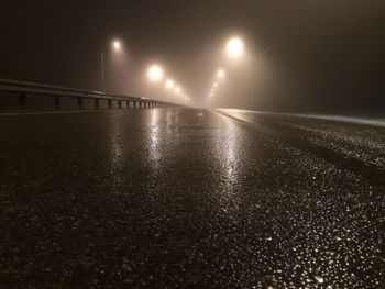 Surface level of wet street at night