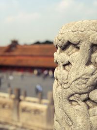 Close-up of statue against building