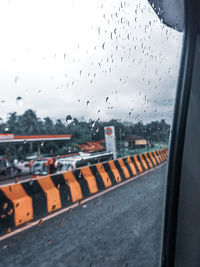 Raindrops on glass window during rainy season