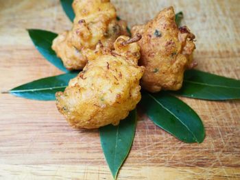 High angle view of meat and leaves on table