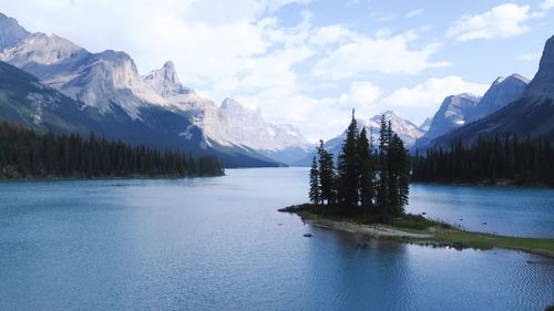 Scenic view of lake and mountains against sky