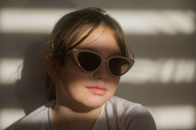 Portrait of young woman wearing sunglasses