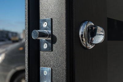 Close-up of padlock on door