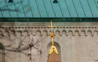 Low angle view of statue against building