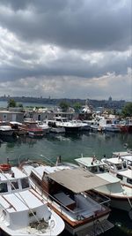 High angle view of harbor by city against sky