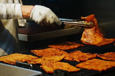 Close-up of man preparing food