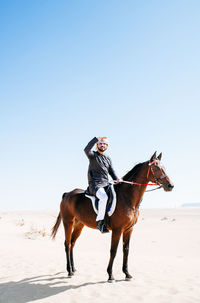 Man riding horse