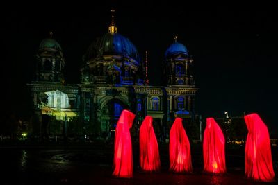 Low angle view of illuminated temple against sky at night