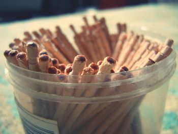 Close-up of toothpicks in container