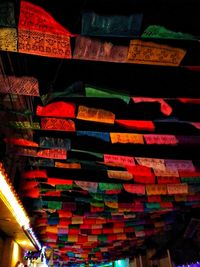 Low angle view of multi colored lights