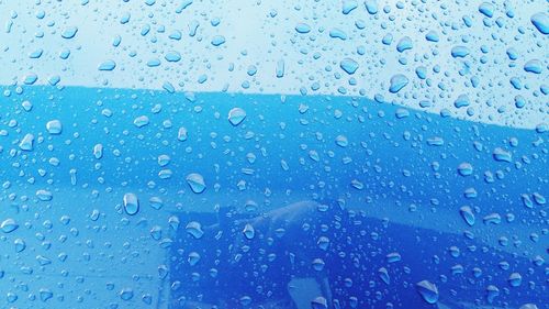 Full frame shot of wet window in rainy season