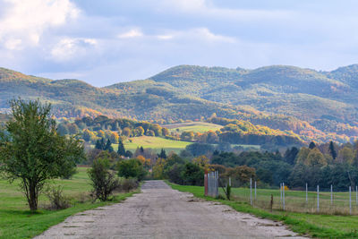 Road amidst landscape against sky