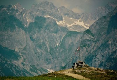 Scenic view of bench on top of mountain