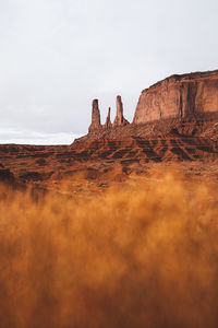 Rock formations on landscape against sky