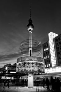 Low angle view of illuminated tower at night