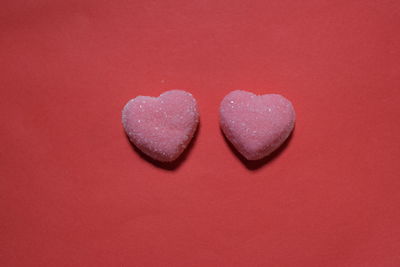 Close-up of heart shape on red background