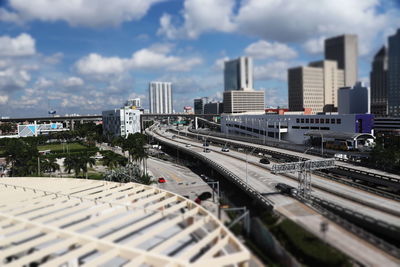 High angle view of railroad tracks amidst buildings in city